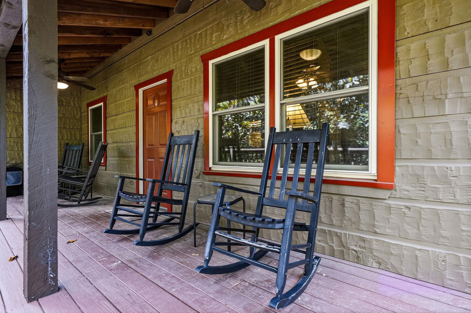 Picture yourself rocking gently on this covered porch, coffee in hand, taking in the peaceful morning air. Classic charm meets relaxation with inviting seating for unwinding after your days adventure