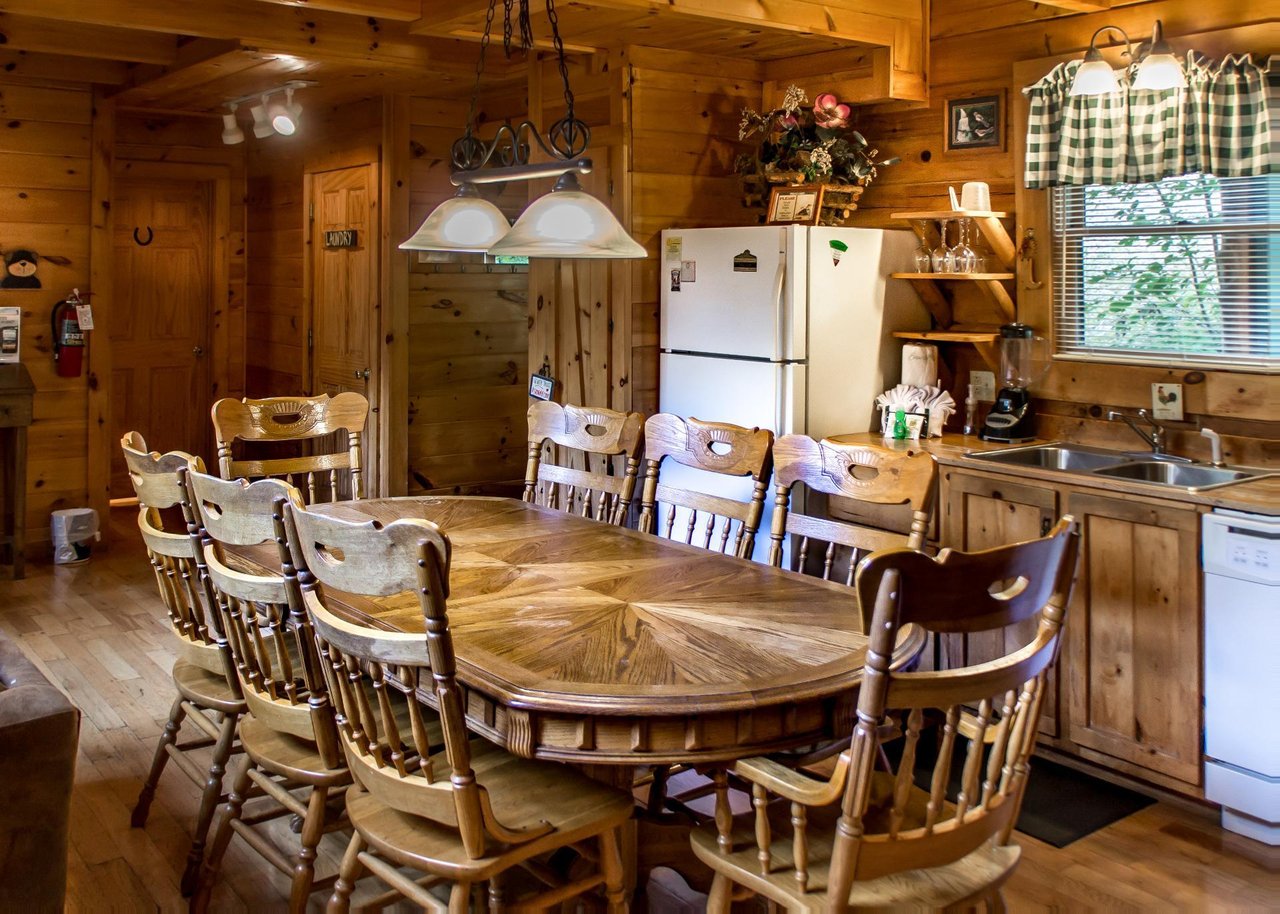 Prepare meals with ease in the wellequipped kitchen and enjoy group dinners at the eightperson dining table.