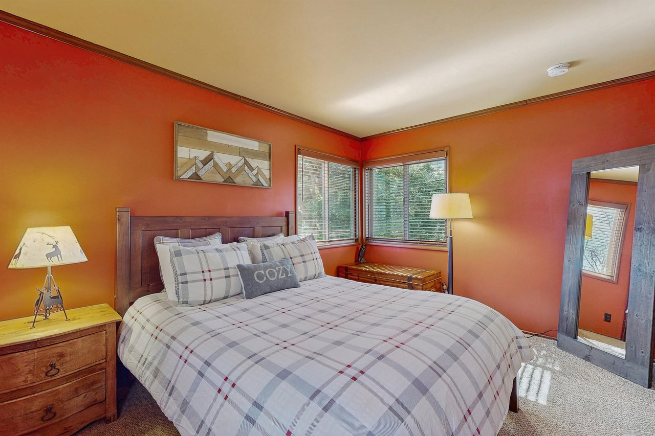 Upstairs guest bedroom with queen bed.