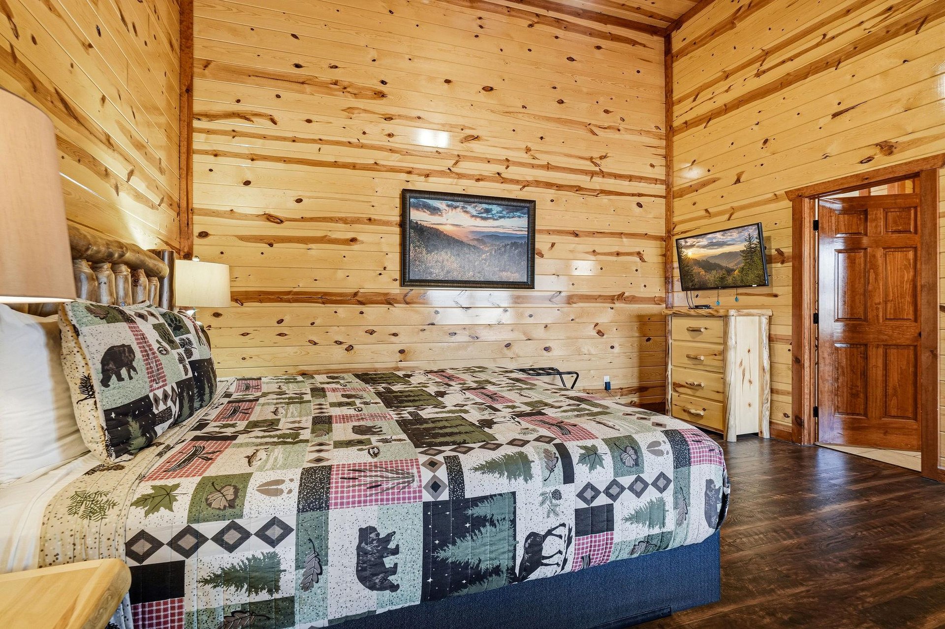 Cozy log cabin bedroom with rustic charm—your peaceful retreat with warm wood walls and naturethemed bedding.