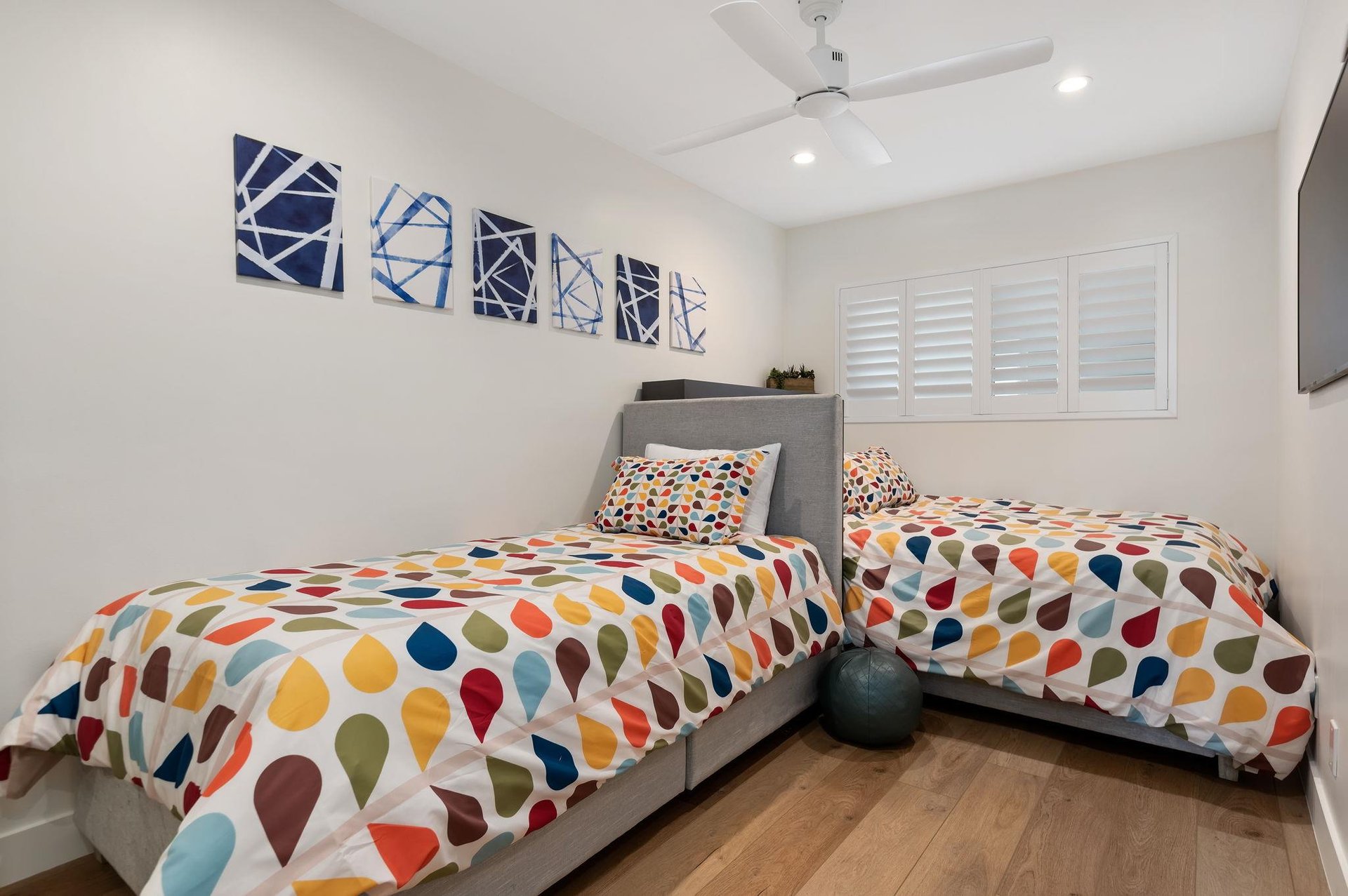 Second Bedroom with two single beds with lots of natural light.