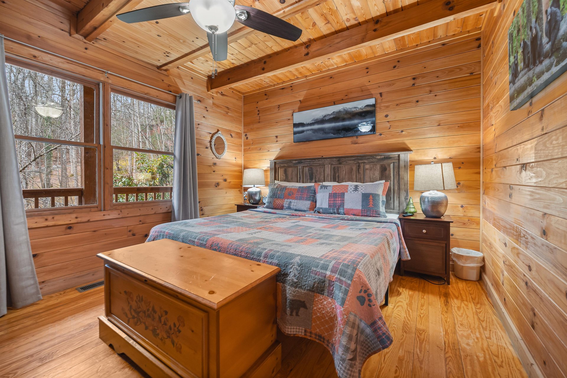 King bed with two windows and cedar chest