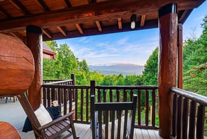 Unwind in your private rocking chair as you take in sweeping mountain vistas framed by lush forest—a perfect spot for your morning coffee or sunset reflections.