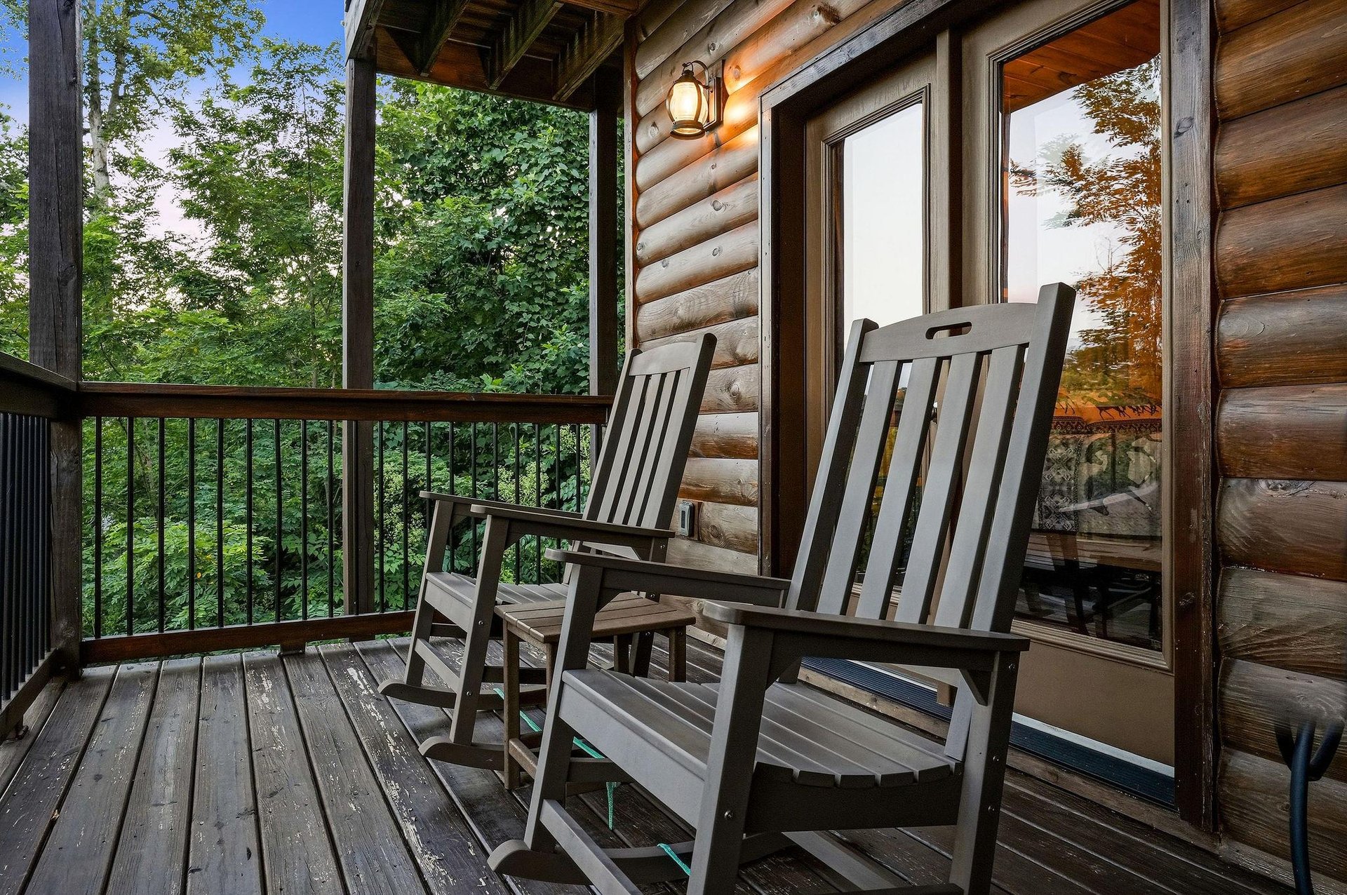 Step onto your private covered balcony and sink into a classic rocking chair, where lush forest views create your peaceful retreat in nature.