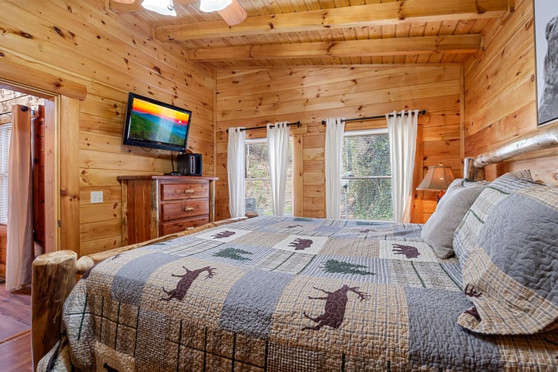 King bed beside windows