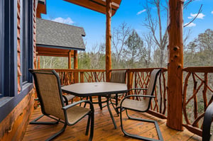 Your private deck overlooking wooded hills offers the perfect spot for morning coffee and peaceful moments surrounded by natures tranquility.