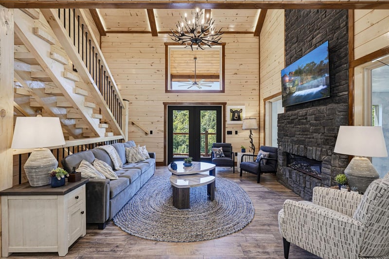 Step into your private mountain retreat with soaring vaulted ceilings, warm wood accents, and a stunning stone fireplace that invites you to unwind in comfort.