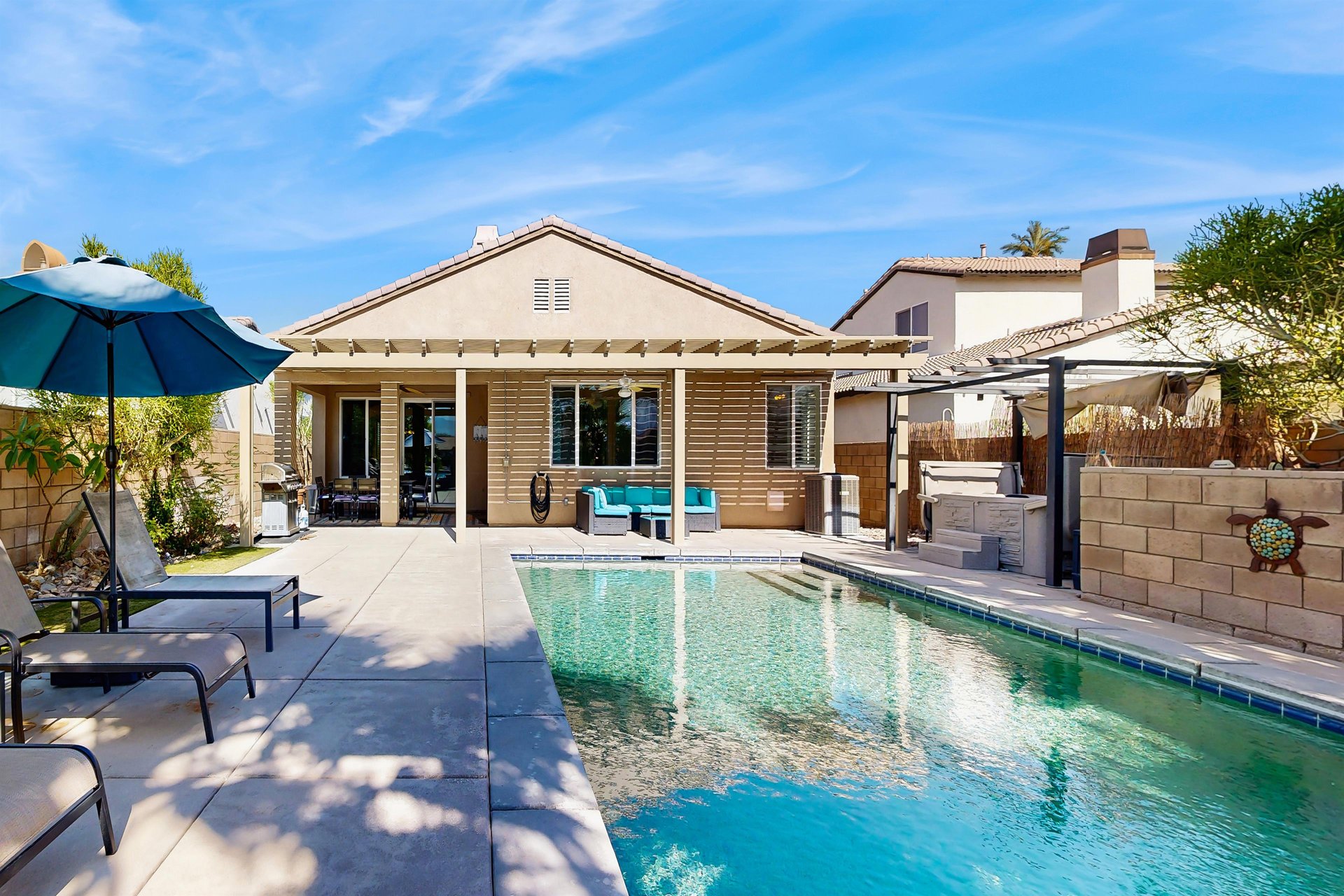 Private pool, hot tub, and sun loungers.