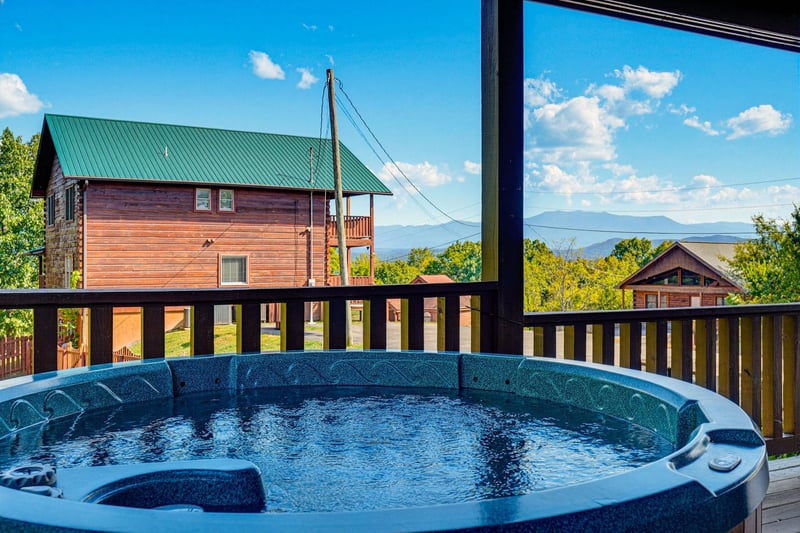 Soak in your private hot tub with sweeping mountain views stretching across the horizon—pure relaxation with nature as your backdrop.