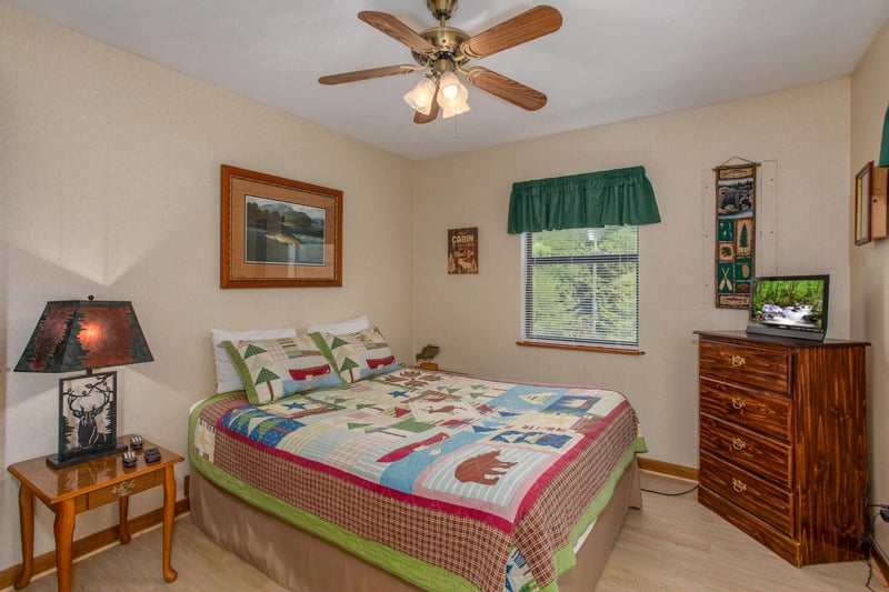 Bedroom with a dresser and television at Black Bear Ridge, a 3bedroom cabin rental located in Pigeon Forge