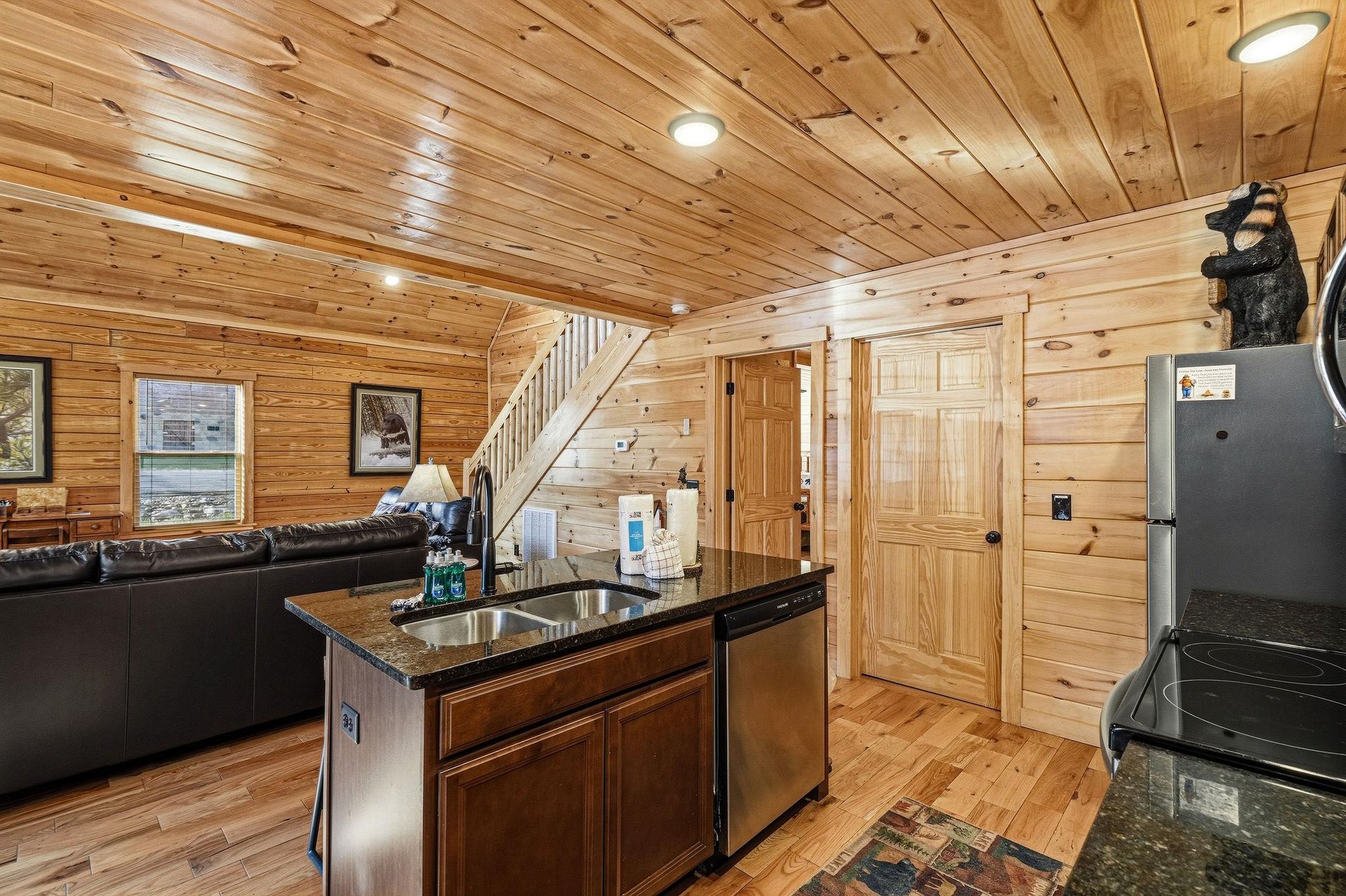 Unwind in your cozy cabins heart, where rustic wood surrounds create warmth while modern appliances ensure comfort for memorable meals.