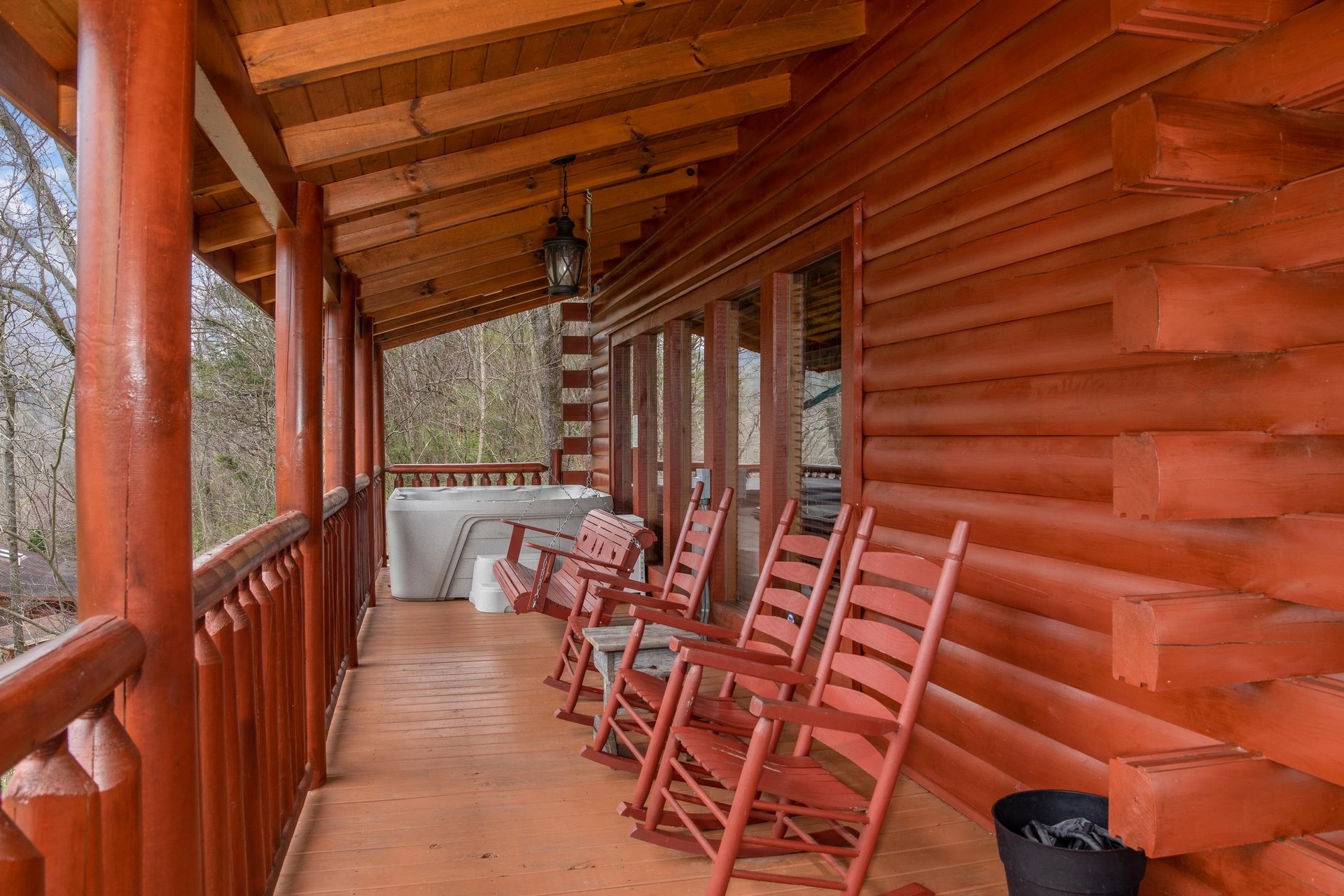 Rocking chairs and hot tub on a covered deck