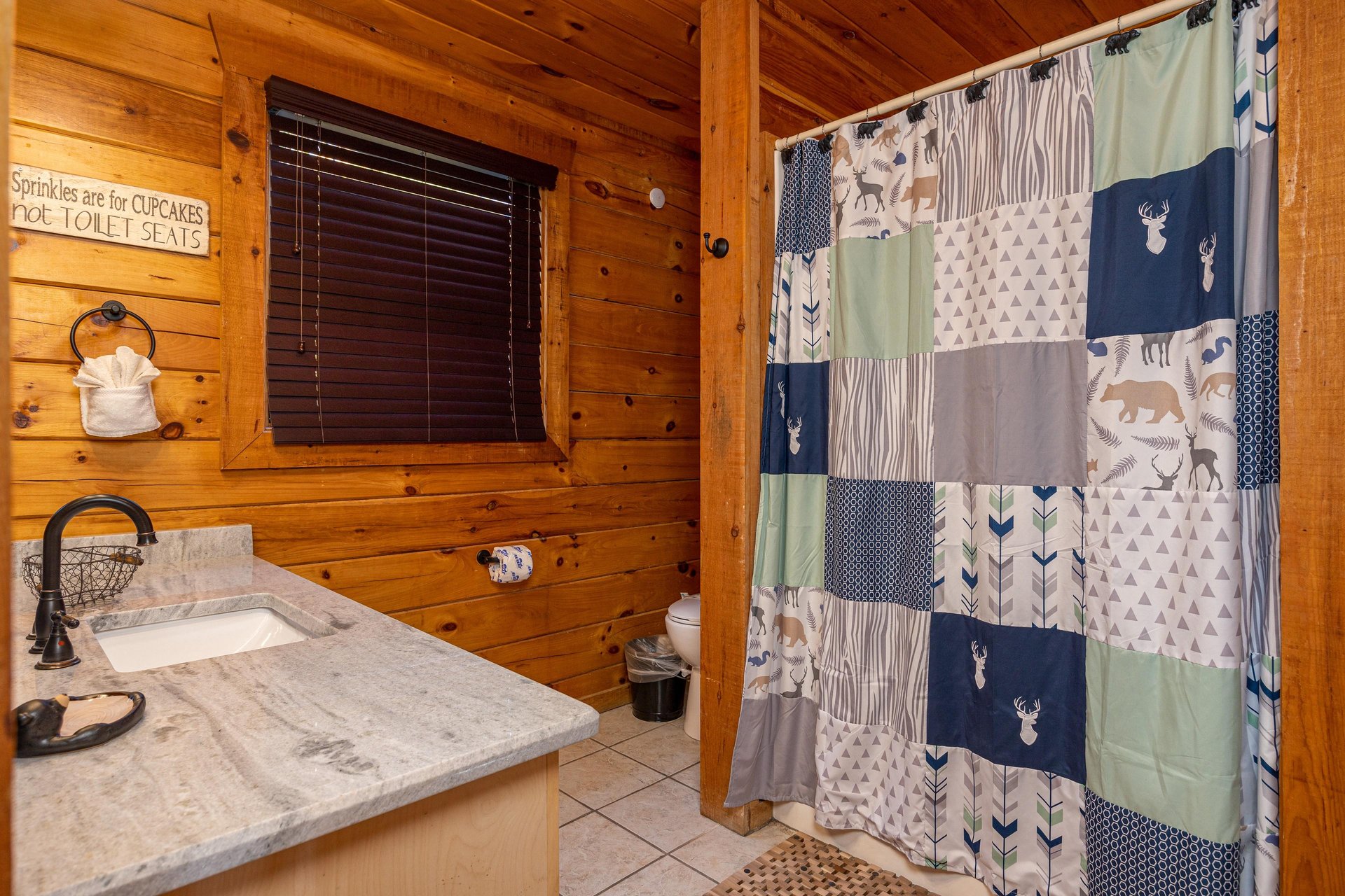 Bathroom with bathshower combo at Bear Feet Retreat, a 1 bedroom cabin rental located in pigeon forge