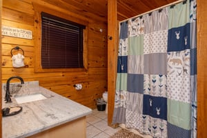 Bathroom with bathshower combo at Bear Feet Retreat, a 1 bedroom cabin rental located in pigeon forge