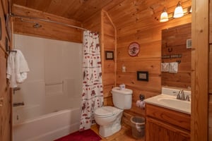 Bathroom with a tub and shower at Logans Smoky Den, a 2 bedroom cabin rental located in Pigeon Forge