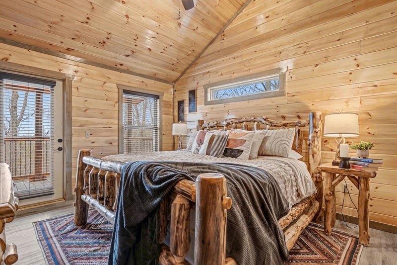 Drift off in rustic comfort beneath soaring wood ceilings, surrounded by handcrafted log furnishings and soft textiles that create your perfect mountain retreat.