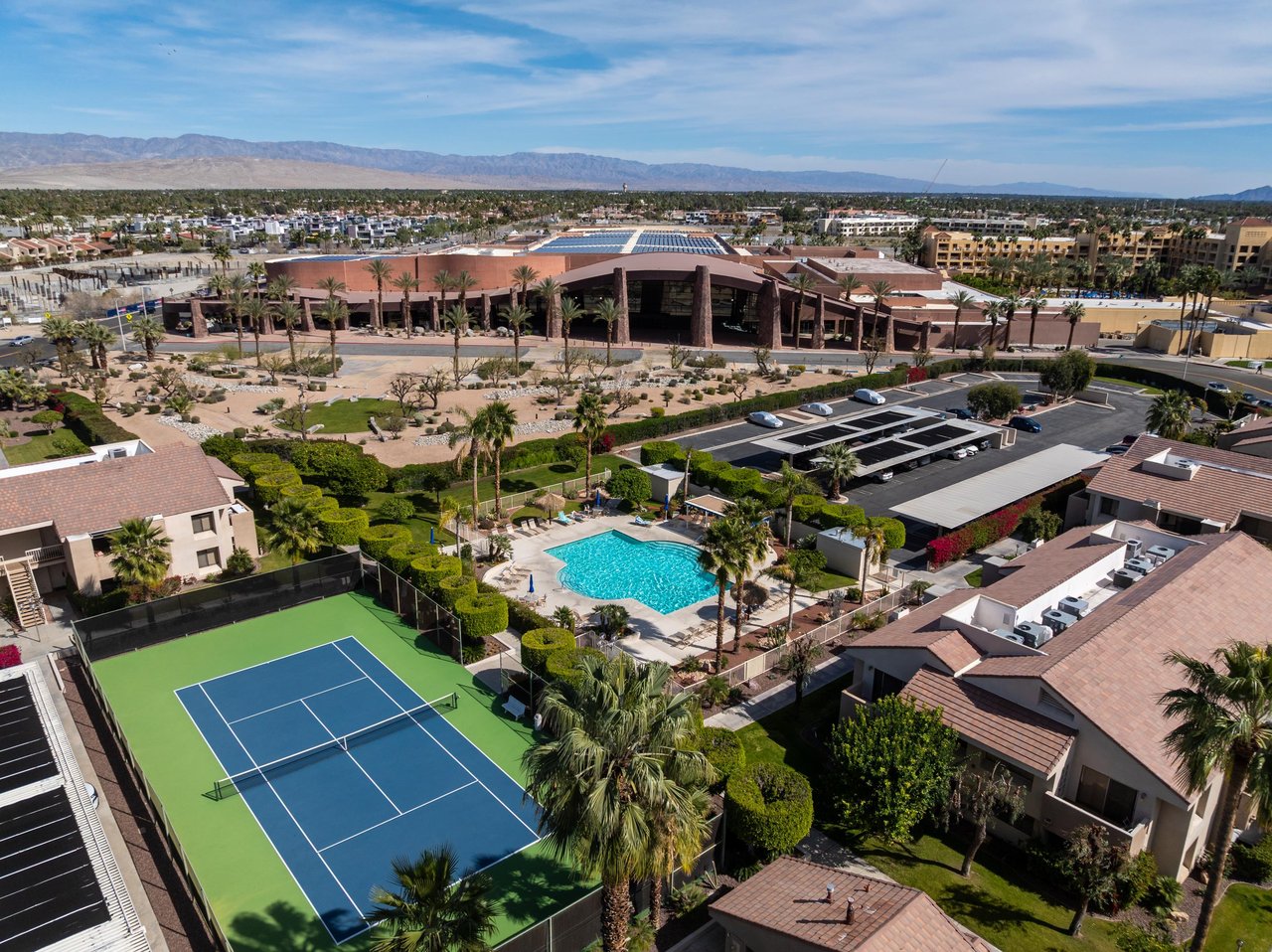 View of the shared tennis court, pool, and spa guests will have access to.