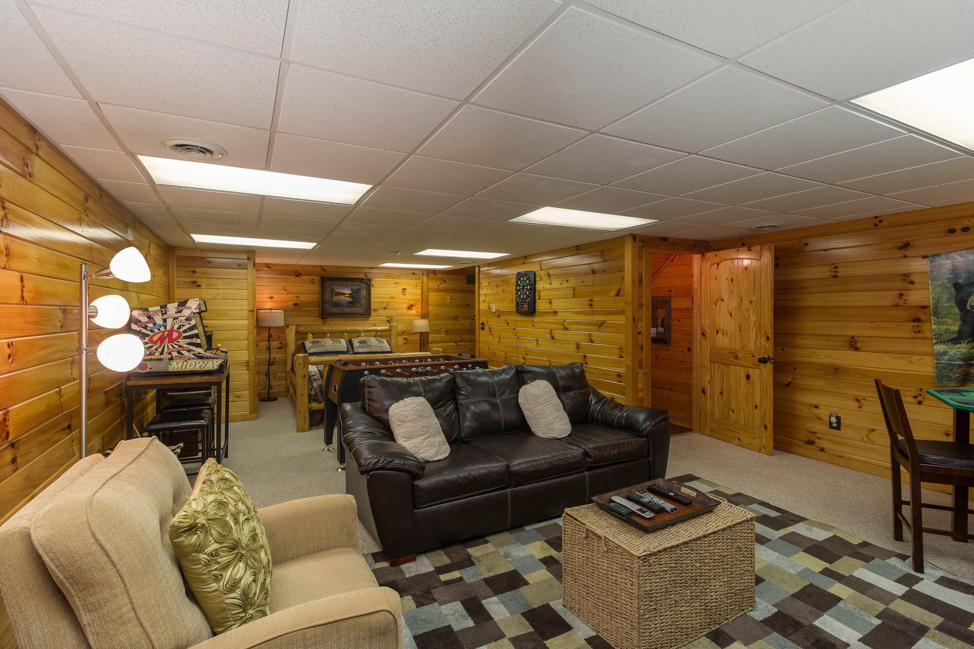 Lower level living room at Kellys Cabin, a 1 bedroom cabin rental located in Pigeon Forge