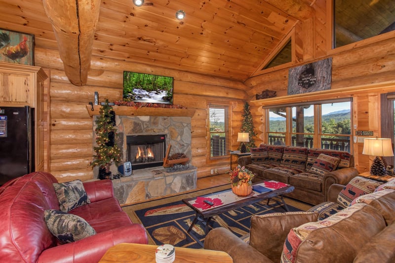 Living room with a fireplace and TV at Great View Lodge, a 5bedroom cabin rental located in Pigeon Forge