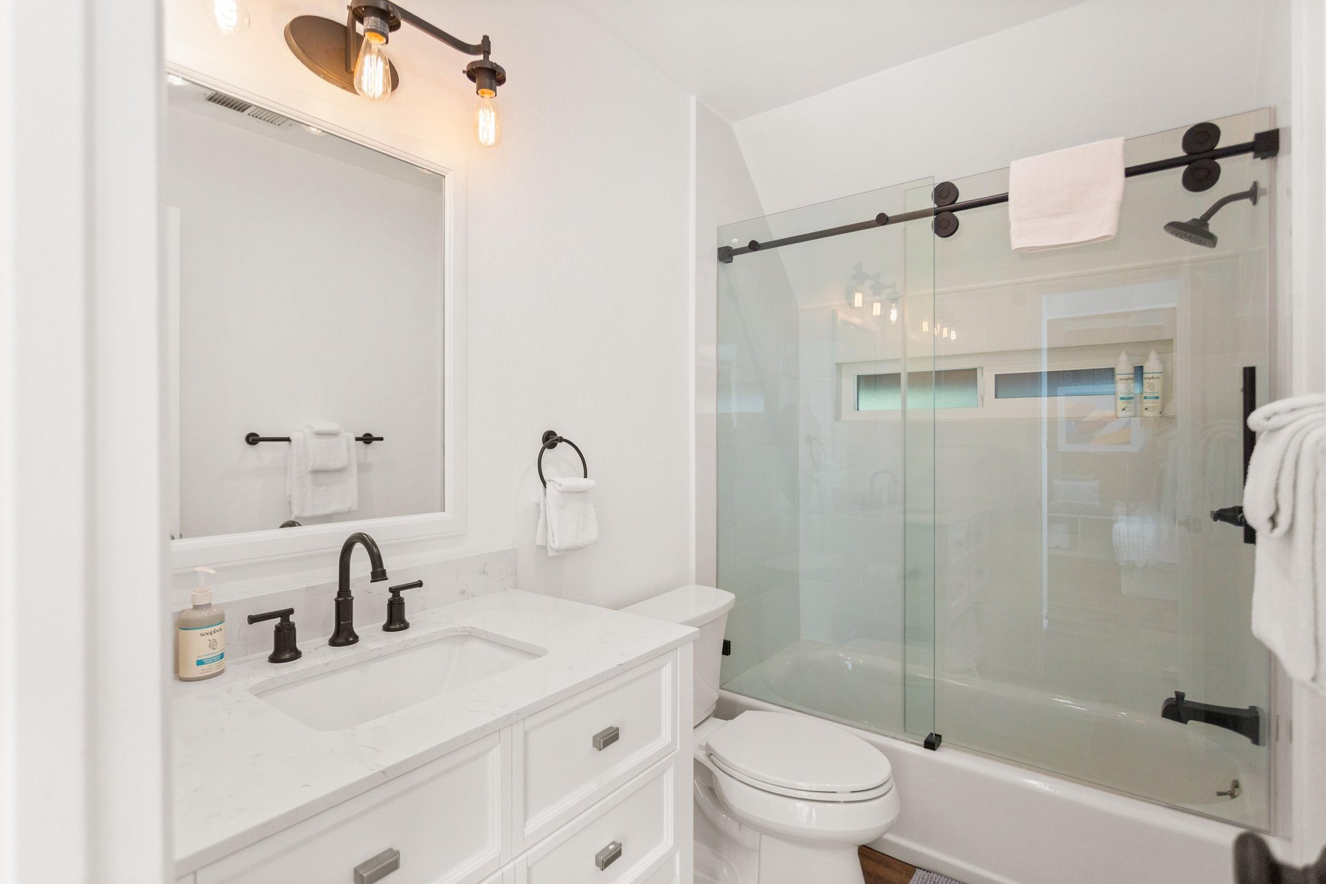 Full bathroom located on the top floor with a showertub combination.