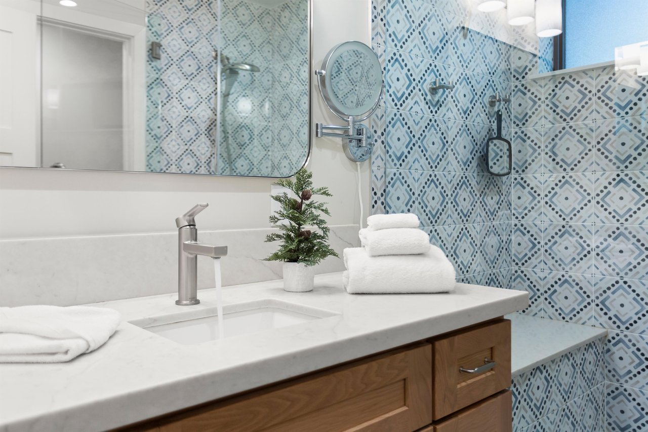 Upstairs with a step in shower and shower seat.