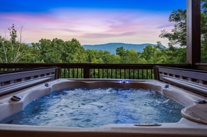 Soak away the day as you gaze at colorful twilight skies and layered mountain ridges from your private hot tub, a perfect blend of relaxation and natural beauty.