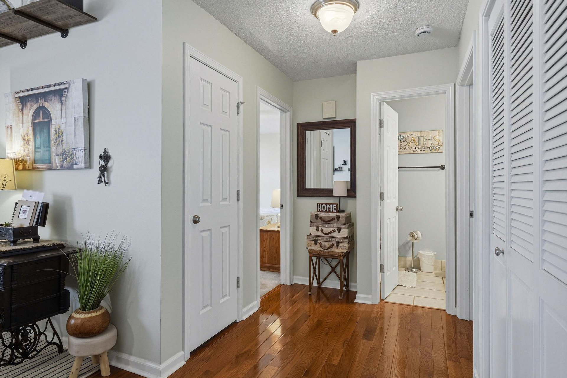 Step into your homeawayfromhome with warm hardwood underfoot, cheerful decor, and thoughtful touches throughout—ready to welcome you after each adventure.