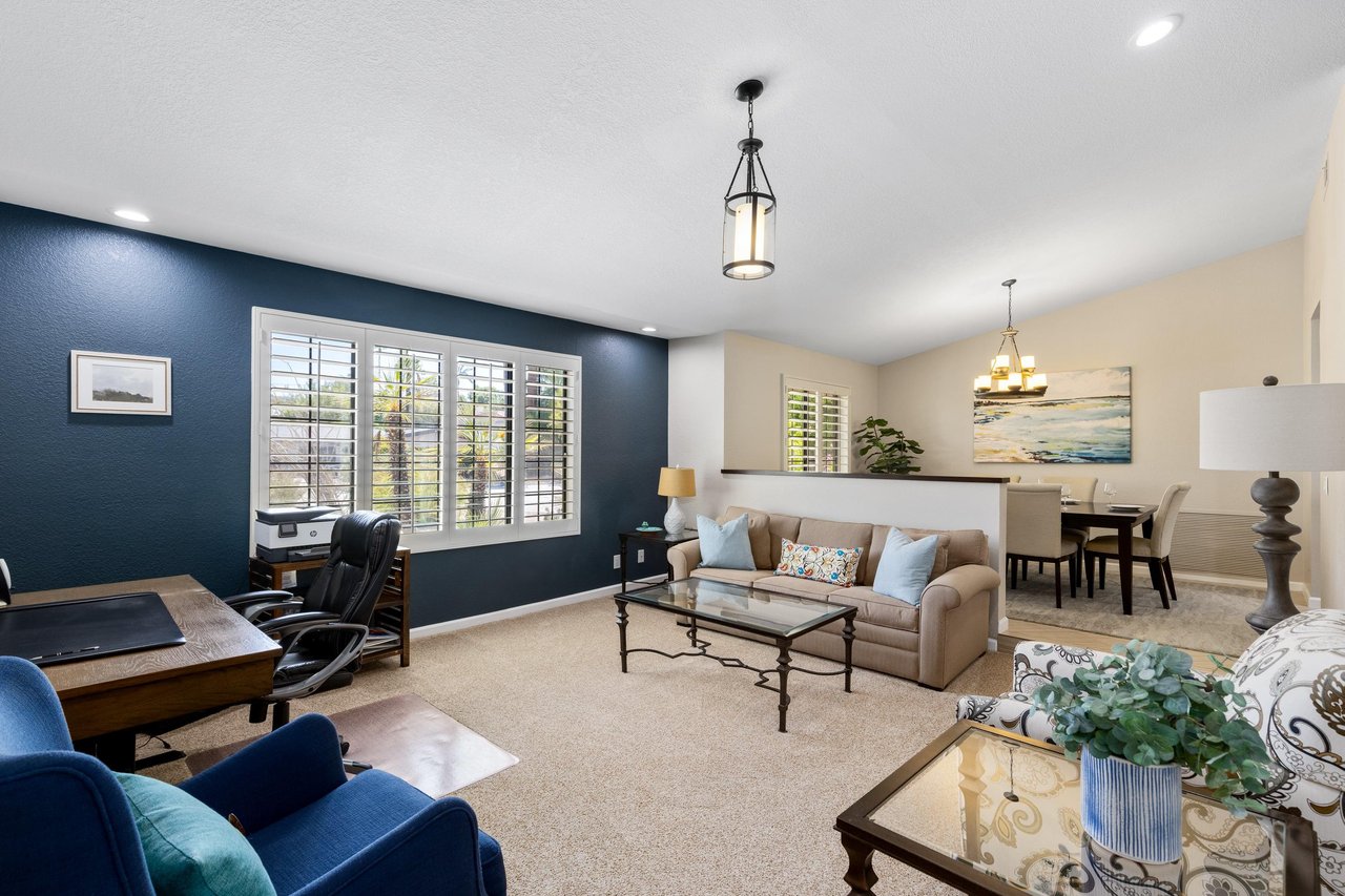 Office space and sitting area just off the dining room and entryway into the home.