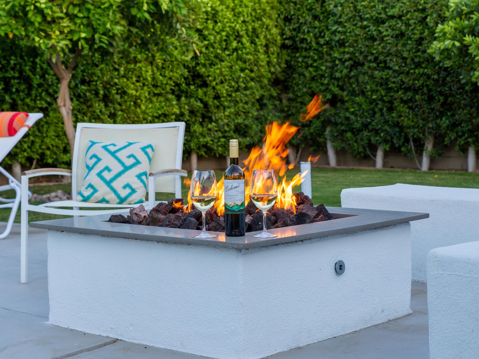Fire pit lounge for enjoying an evening by the pool