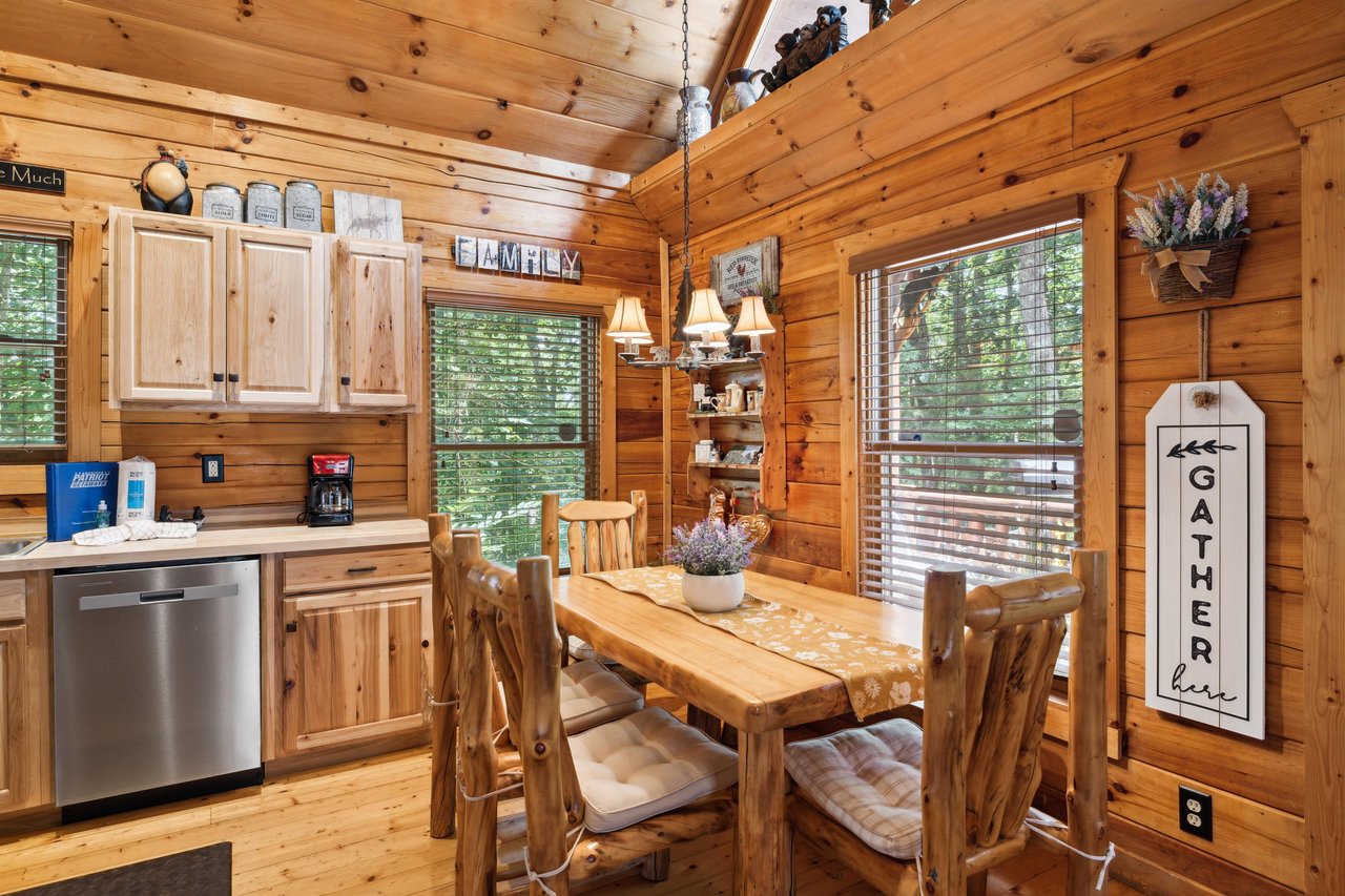 dining table and chairs by windows