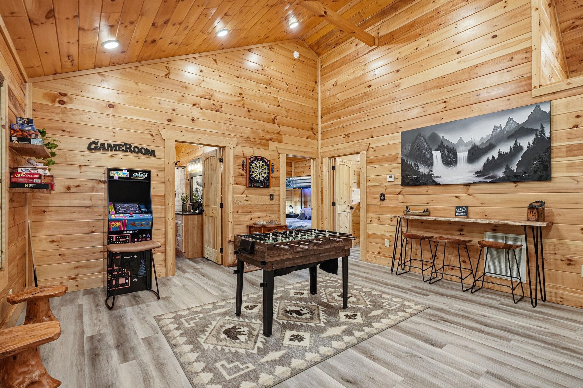 Challenge friends to foosball, arcade classics, or darts in your own private game room—where rustic mountain charm meets endless entertainment.