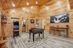 Challenge friends to foosball, arcade classics, or darts in your own private game room—where rustic mountain charm meets endless entertainment.
