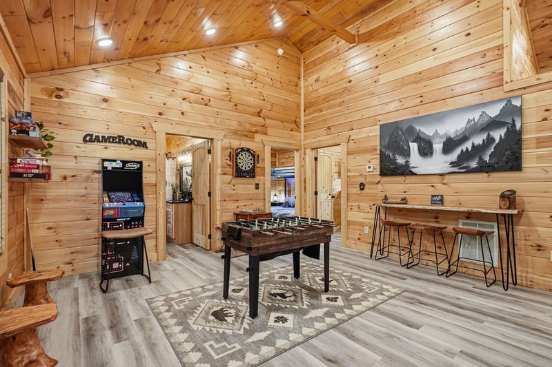Challenge friends to foosball, arcade classics, or darts in your own private game room—where rustic mountain charm meets endless entertainment.