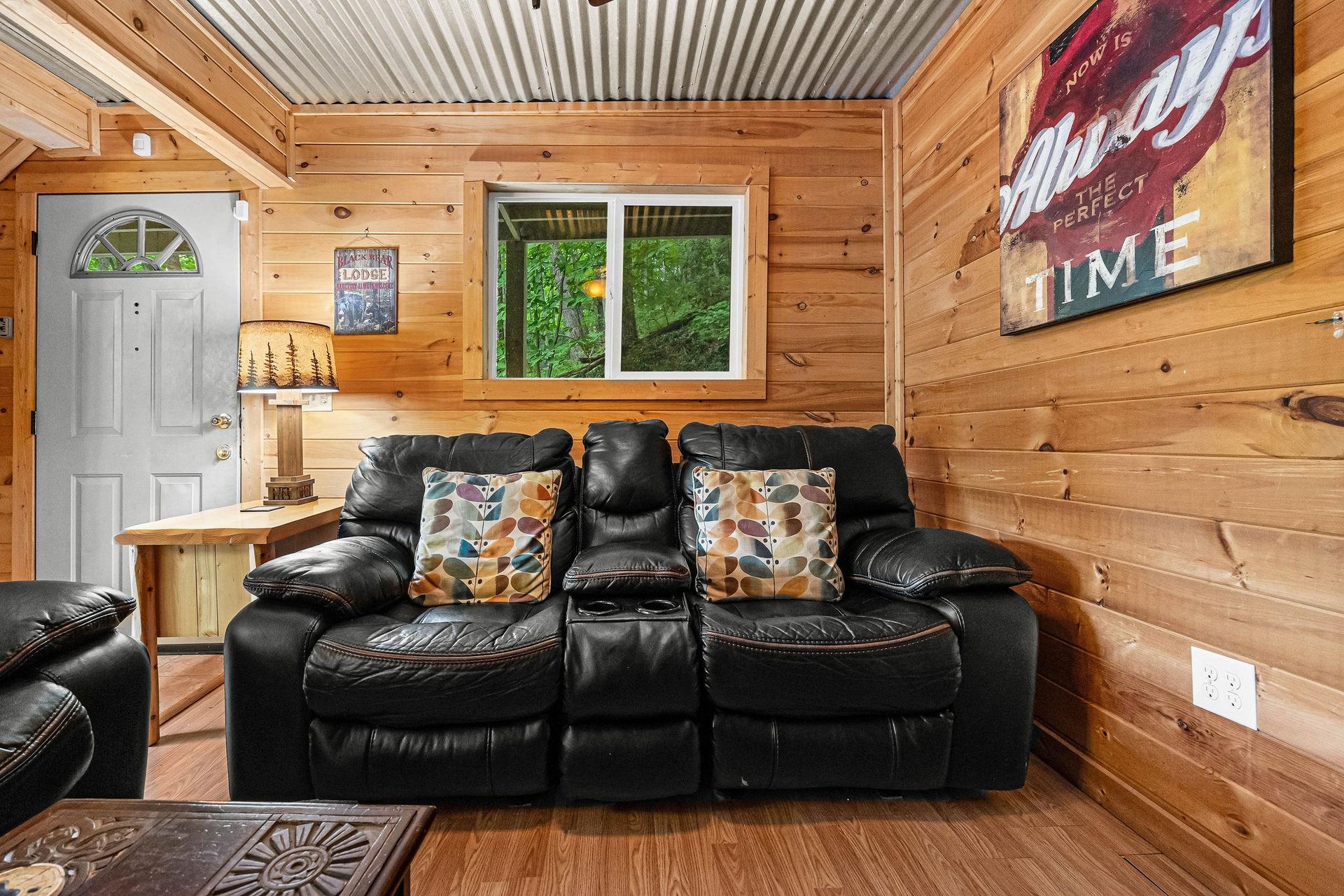 Loveseat in the living room at License to Chill, a 3 bedroom cabin rental located in Gatlinburg