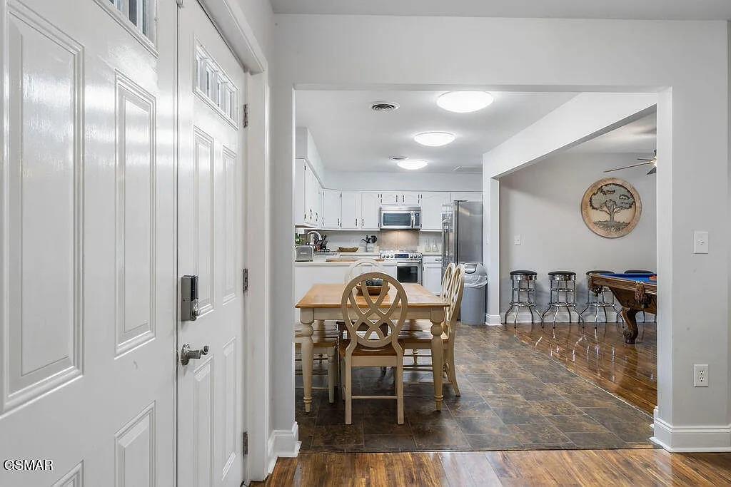 Step into your bright, open kitchen and dining space where youll love preparing meals and sharing stories around the charming wooden table.