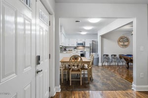 Step into your bright, open kitchen and dining space where youll love preparing meals and sharing stories around the charming wooden table.