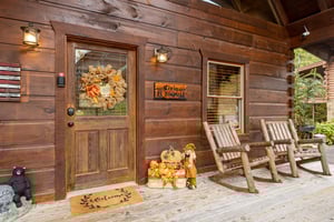 Front door and porch at Livin Simple, a 2 bedroom cabin rental located in Pigeon Forge