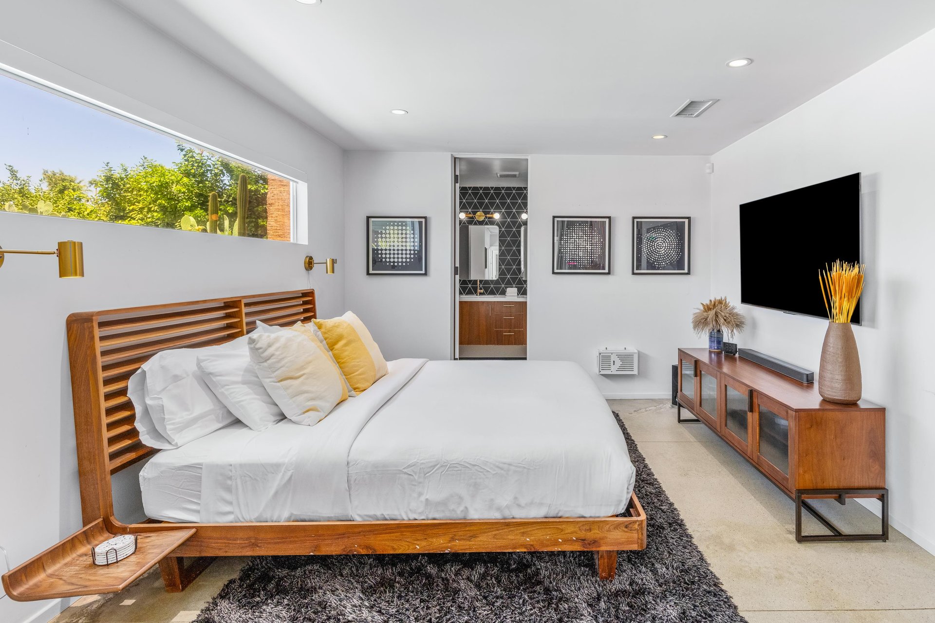 King size bed, desk space, patio access, and ensuite bathroom.