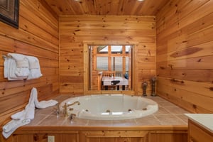 Jacuzzi in the second floor bathroom at Howlin in the Smokies, a 2 bedroom cabin rental located in Pigeon Forge