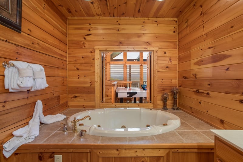 Jacuzzi in the second floor bathroom at Howlin in the Smokies, a 2 bedroom cabin rental located in Pigeon Forge
