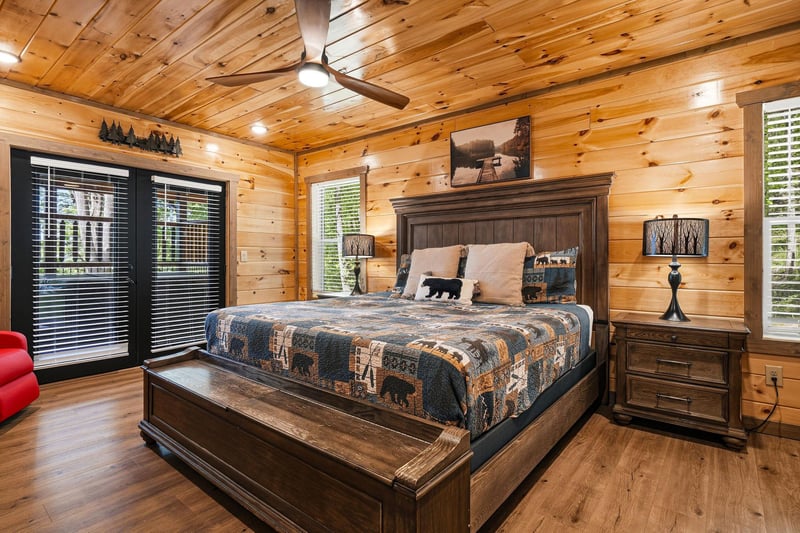 Rest peacefully in your rustic cabin bedroom with warm wood walls, comfortable bedding, and naturethemed decor that creates the perfect mountain retreat atmosphere.