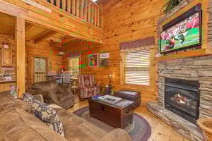 Living room fireplace at Livin Simple, a 2 bedroom cabin rental located in Pigeon Forge