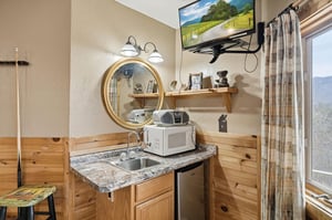 Your cozy mountain kitchenette combines rustic charm with modern convenience, featuring granite counters and scenic valley views.