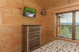 King bed facing dresser and tv