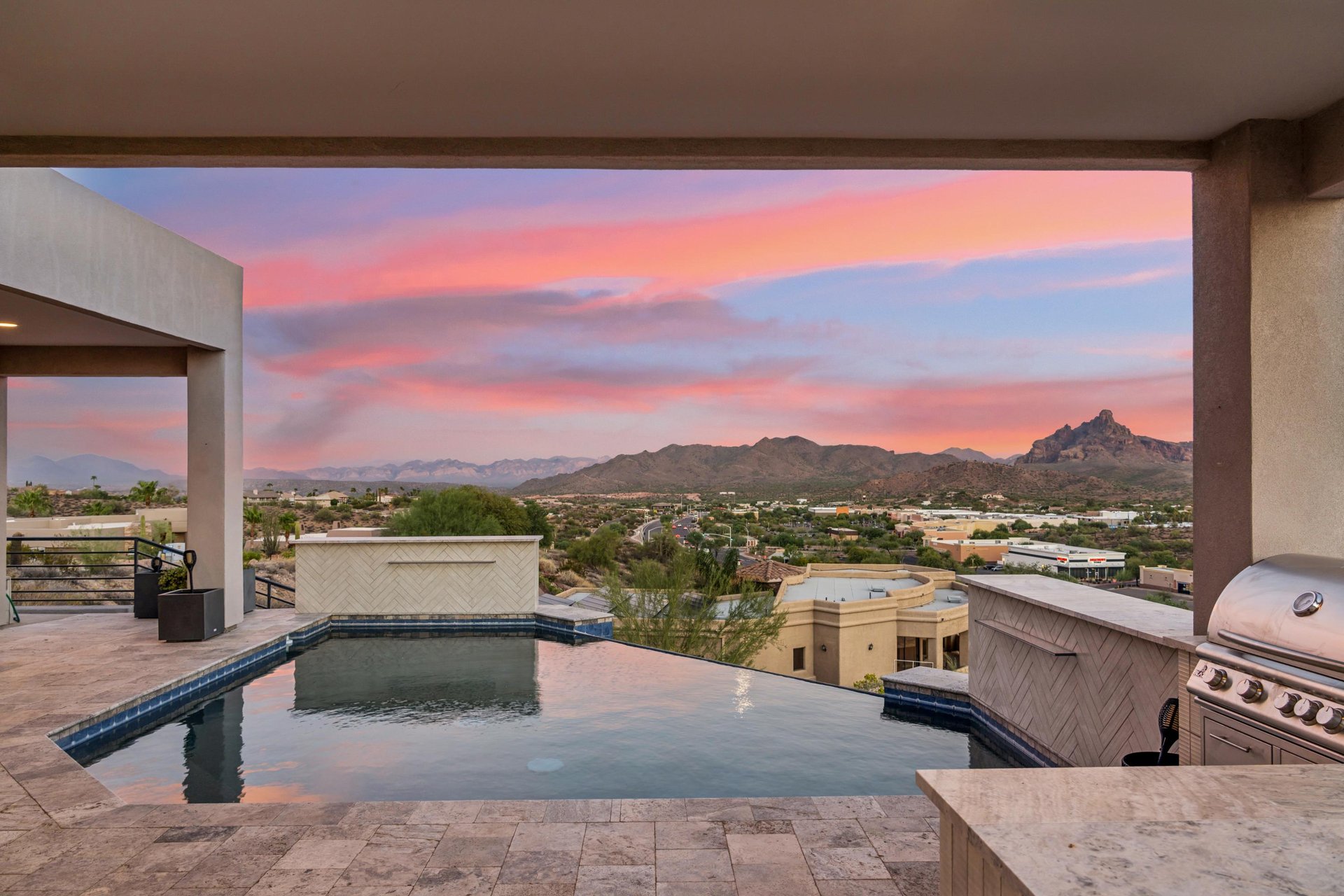 Private infinity pool overlooking mountain views.
