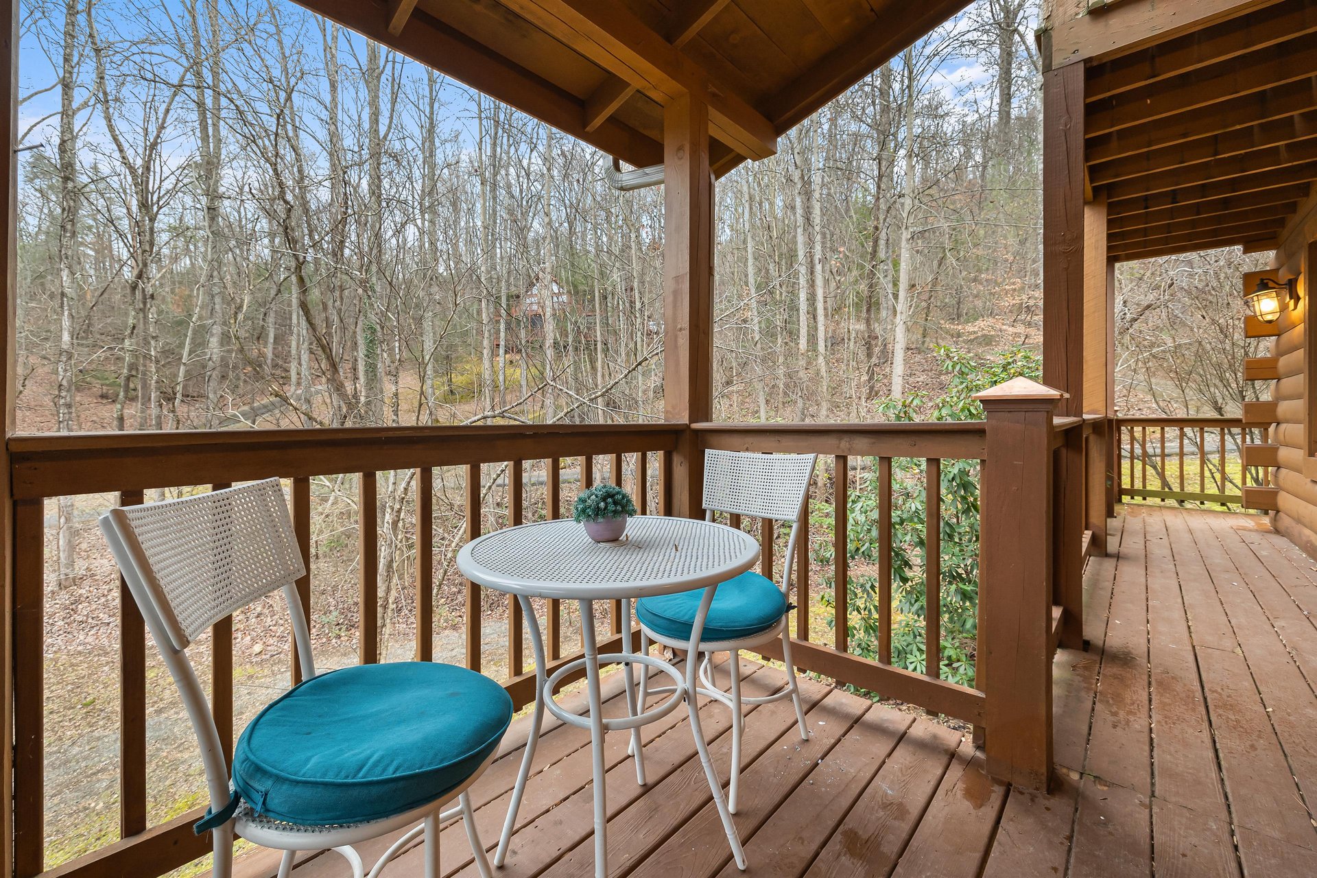 Deck table and chairs with cushions