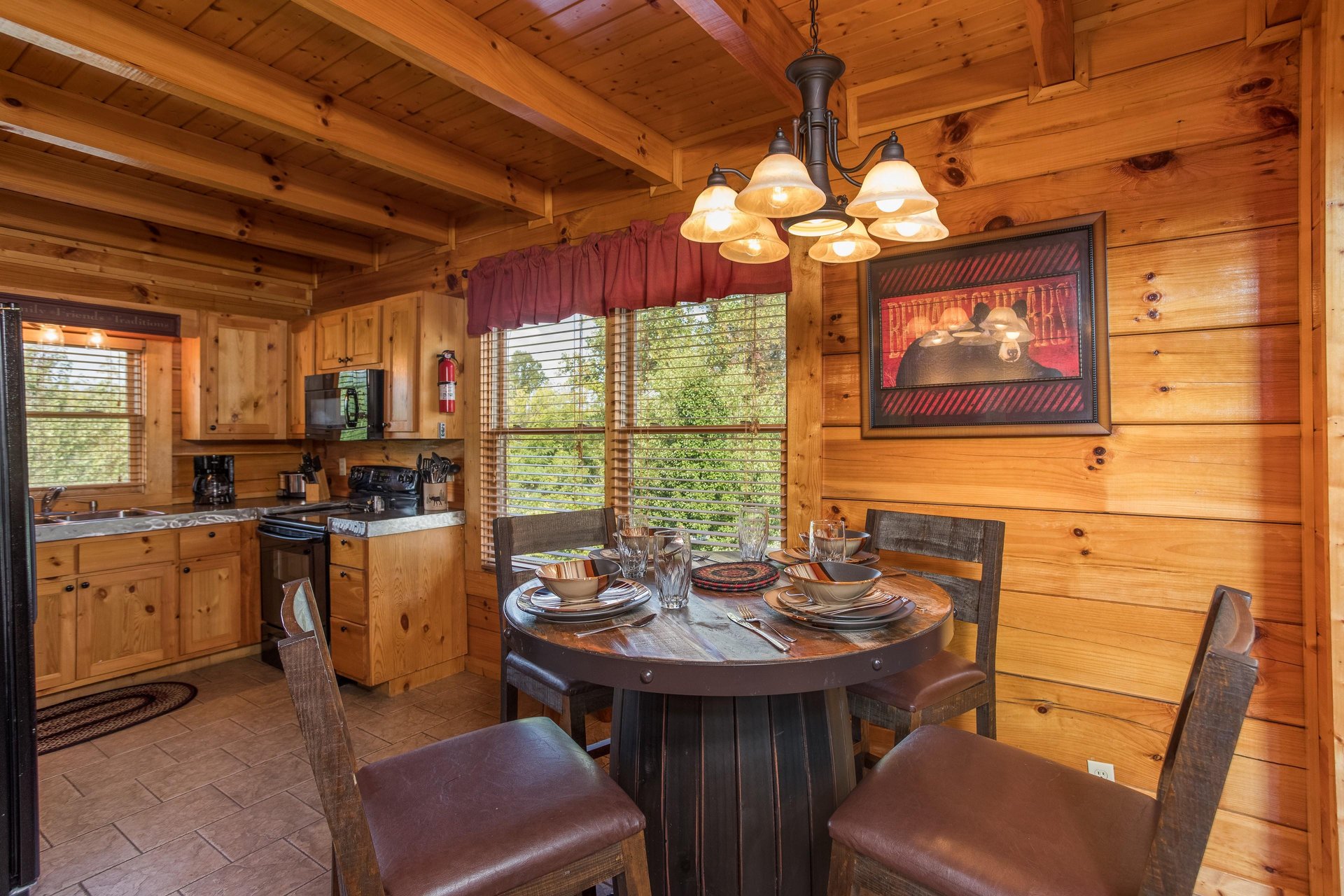 Dining table for 4 in the kitchen at Graceland, a 4bedroom cabin rental located in Pigeon Forge