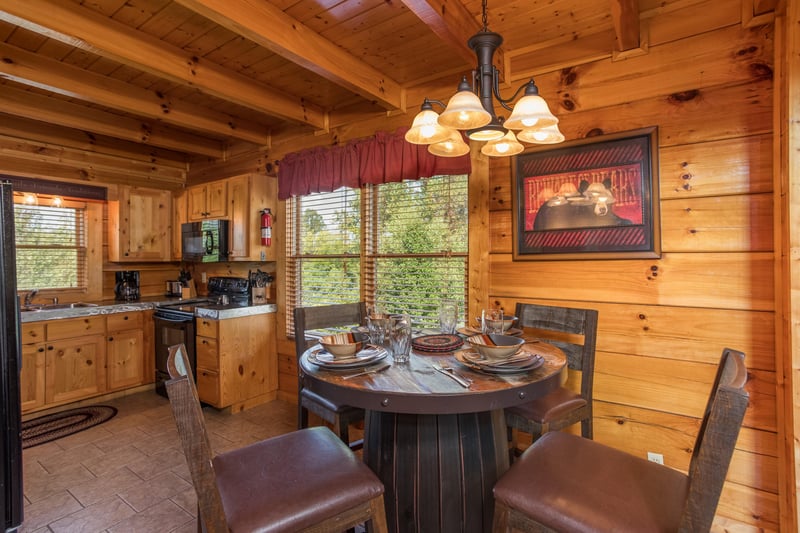 Dining table for 4 in the kitchen at Graceland, a 4bedroom cabin rental located in Pigeon Forge