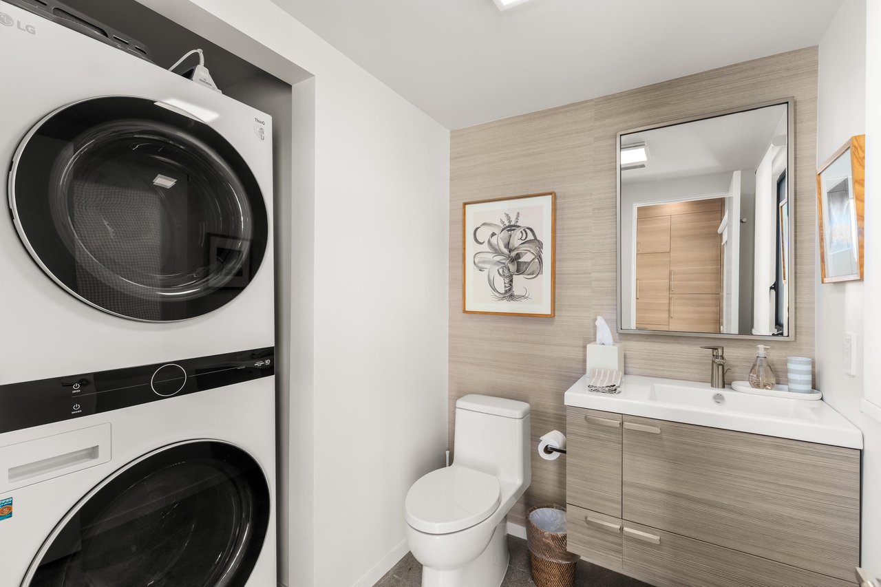 Stylish bathroom with convenient inunit laundry