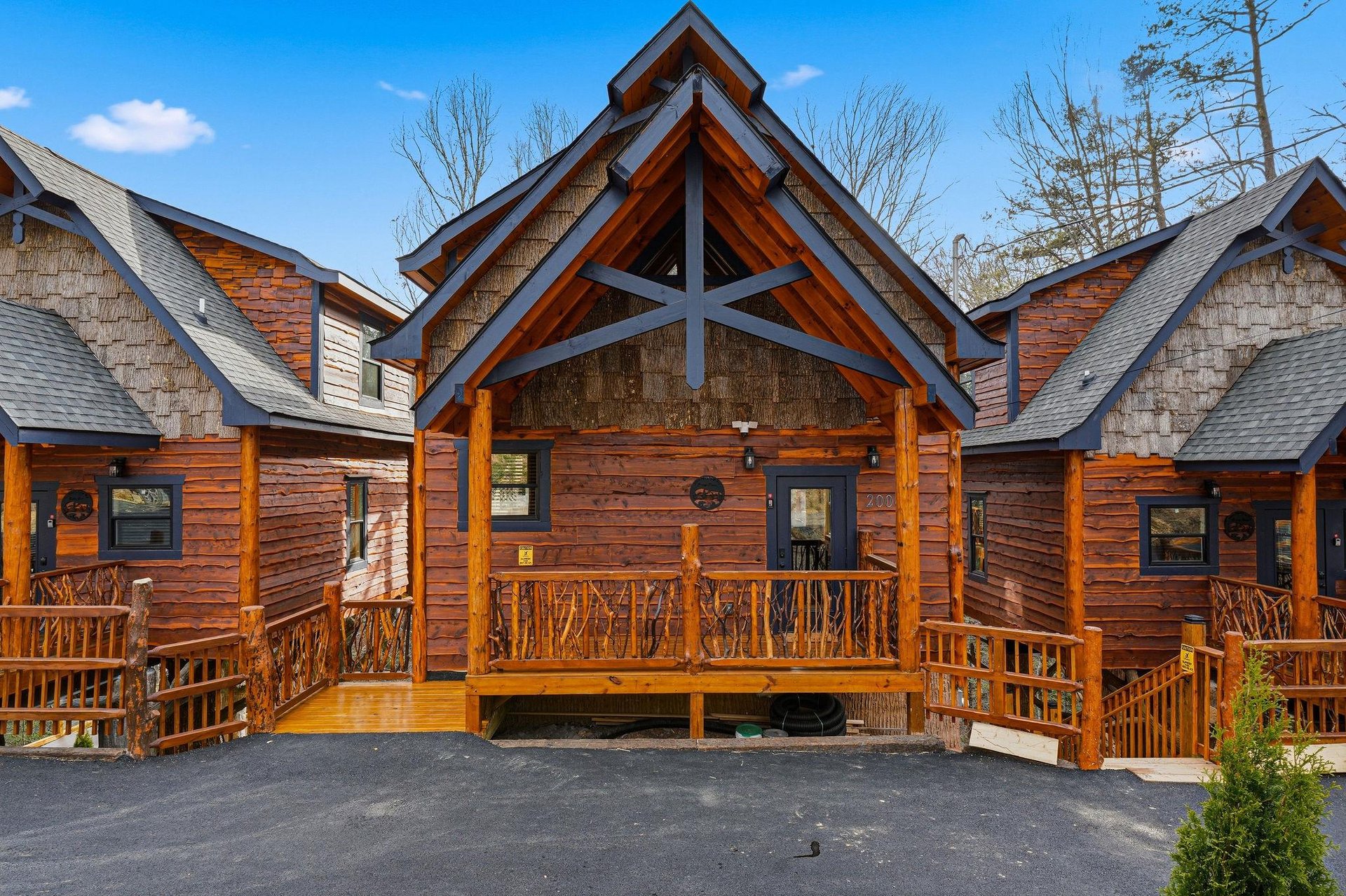 Beautiful log cabin exterior featuring rustic charm with natural wood siding, covered porch, and mountainstyle architecture.